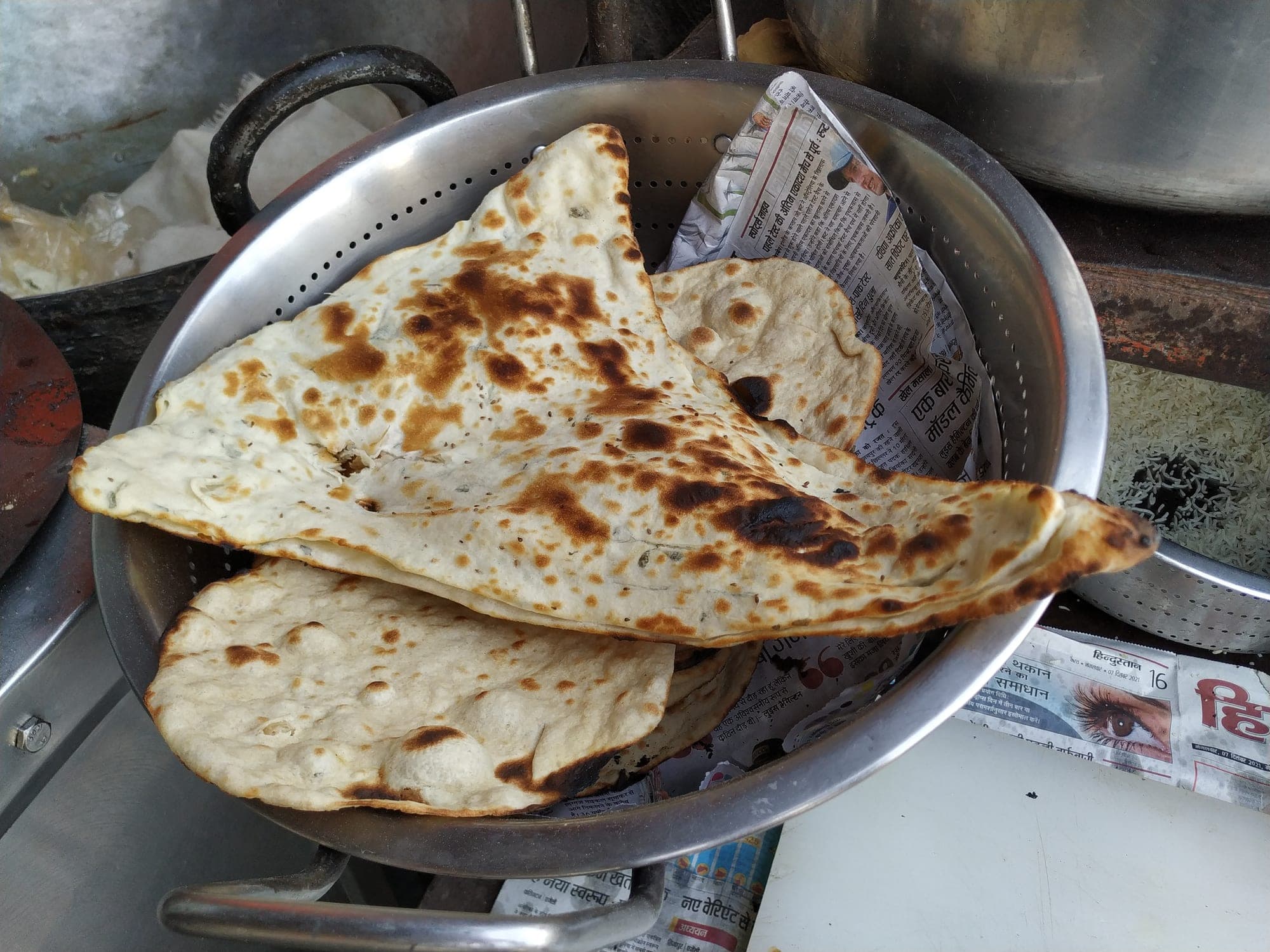 Naan baking in the clay tandoor
